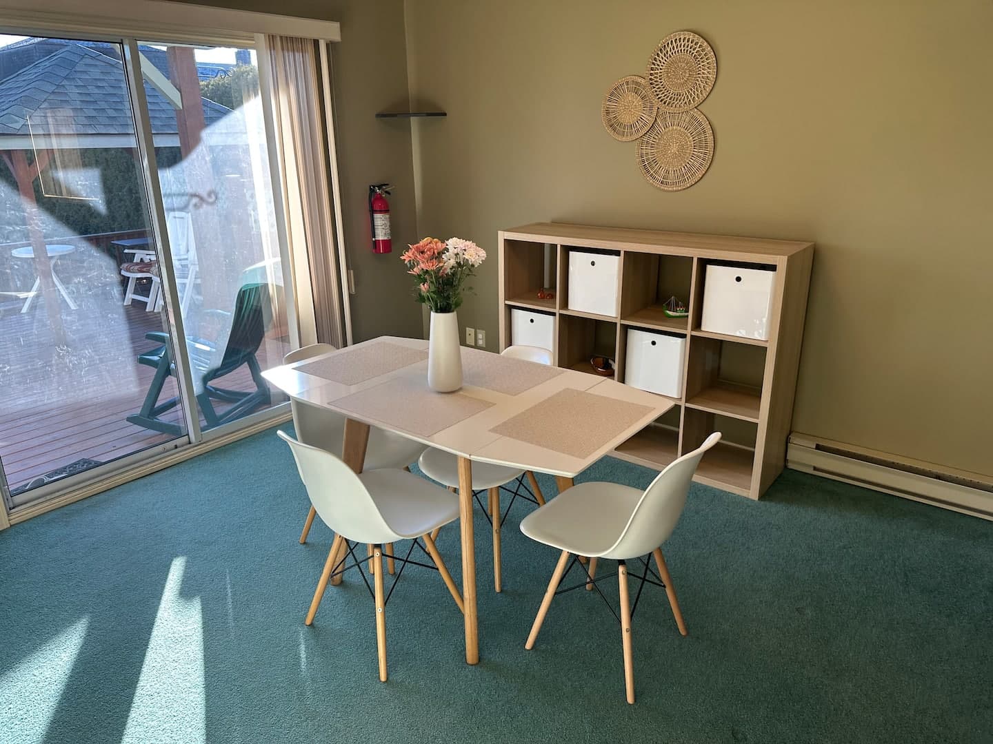 Dining table beside the sliding doors to the deck